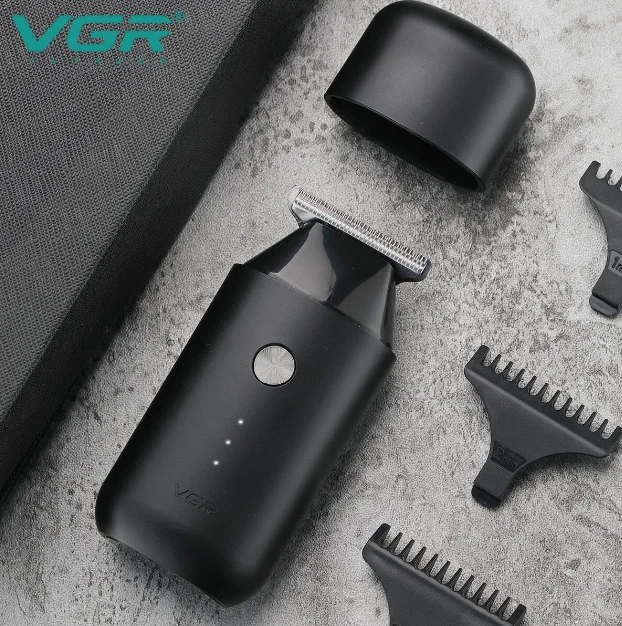 VGR V-932 trimmer with cap and T-blade guide clips on stone surface